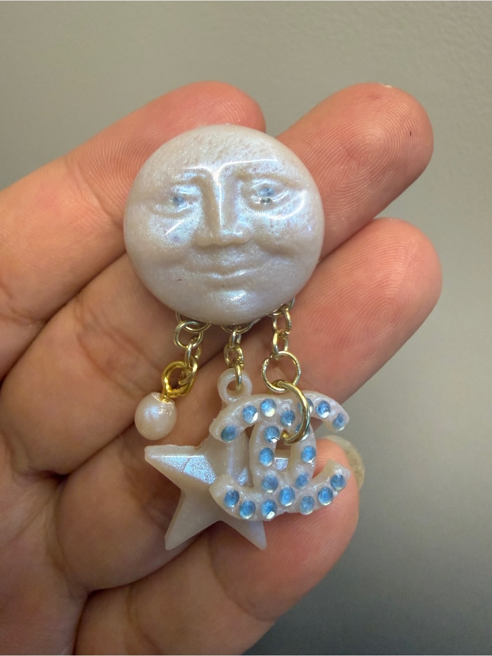 Pale Blue Moon Face Dangle Earrings with Gold Accents